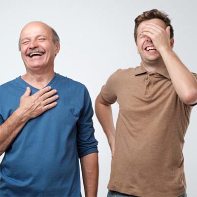 Two Dads laughing at jokes