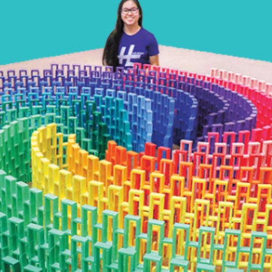 teen with colorful plastic art