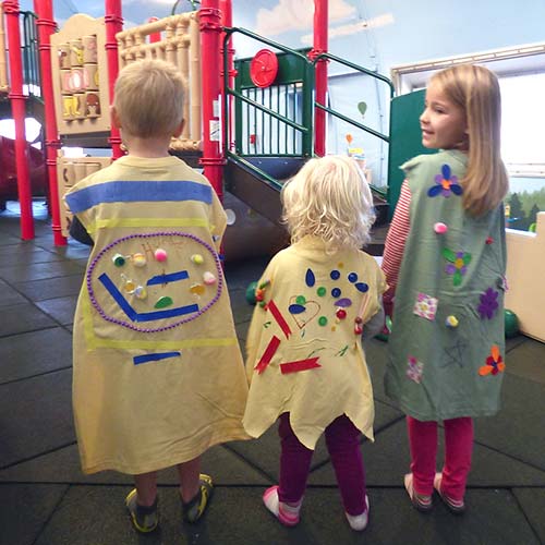three kids wearing DIY personalized capes