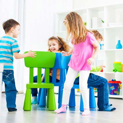 Kids playing musical chairs 