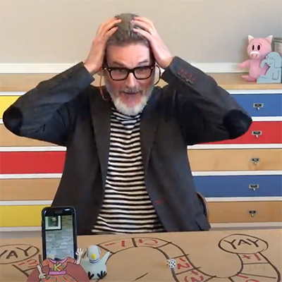 Mo Willems holding hands on head 