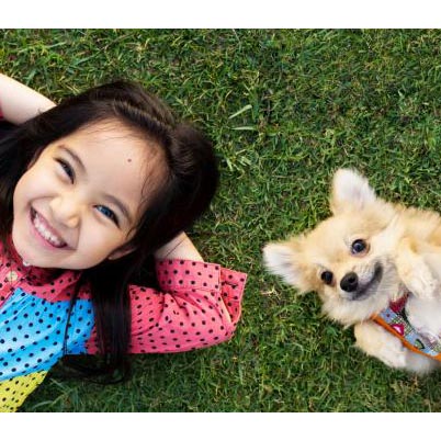 Girl smiling and little dog