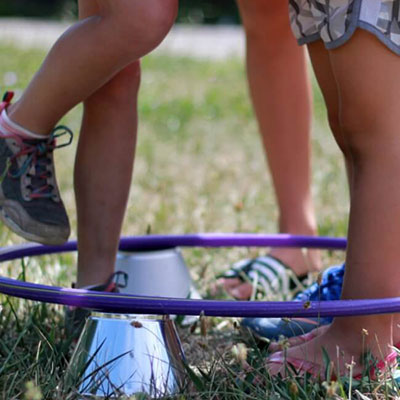kids feet in a hula-hoop