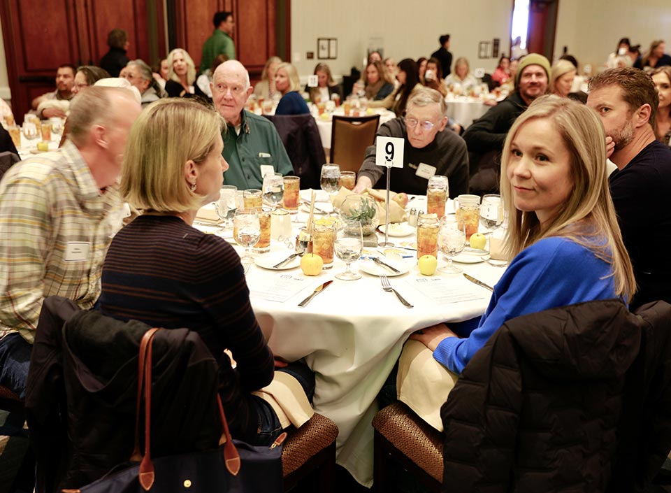 Attendees at table enjoying lunch at the KidZone's Think Big fundraiser
