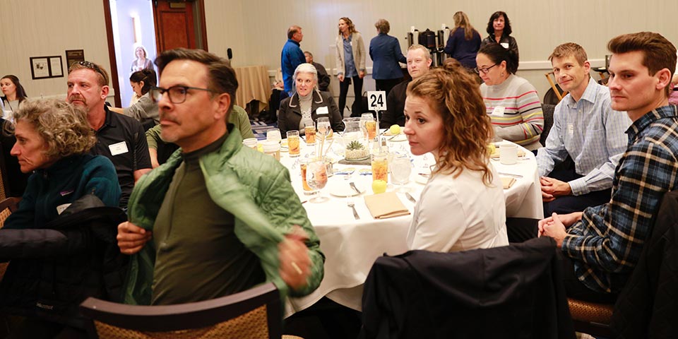 Attendees at table enjoying lunch at the KidZone's Think Big fundraiser