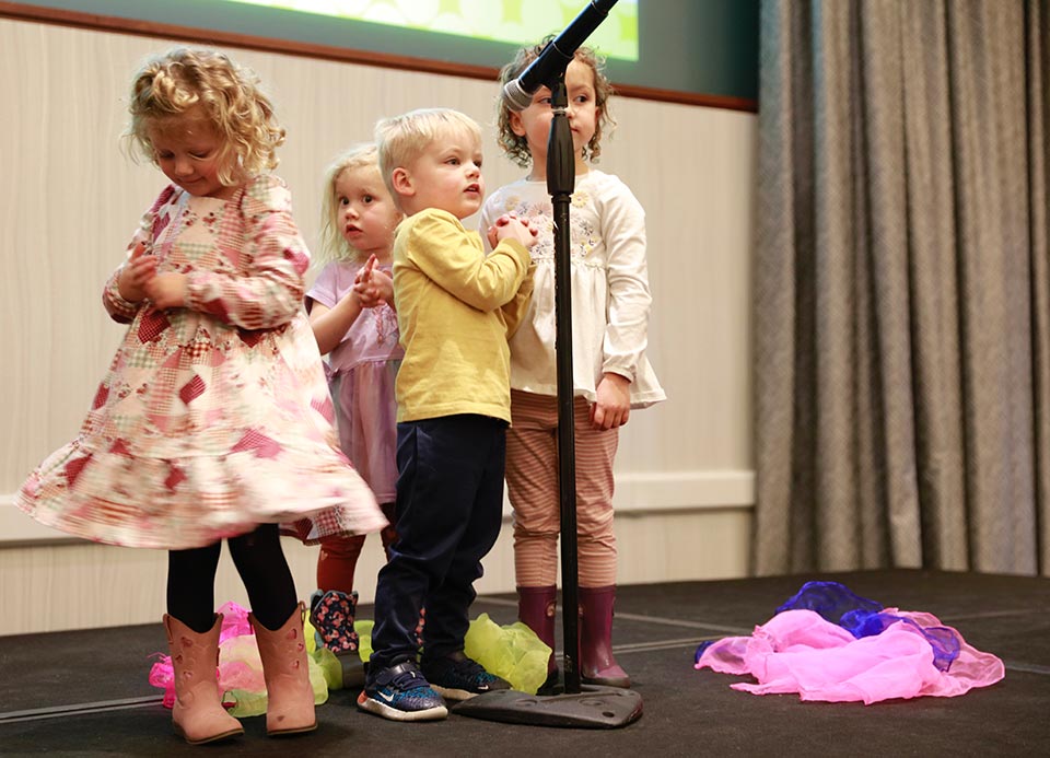 Children on stage at the KidZone's Think Big fundraiser