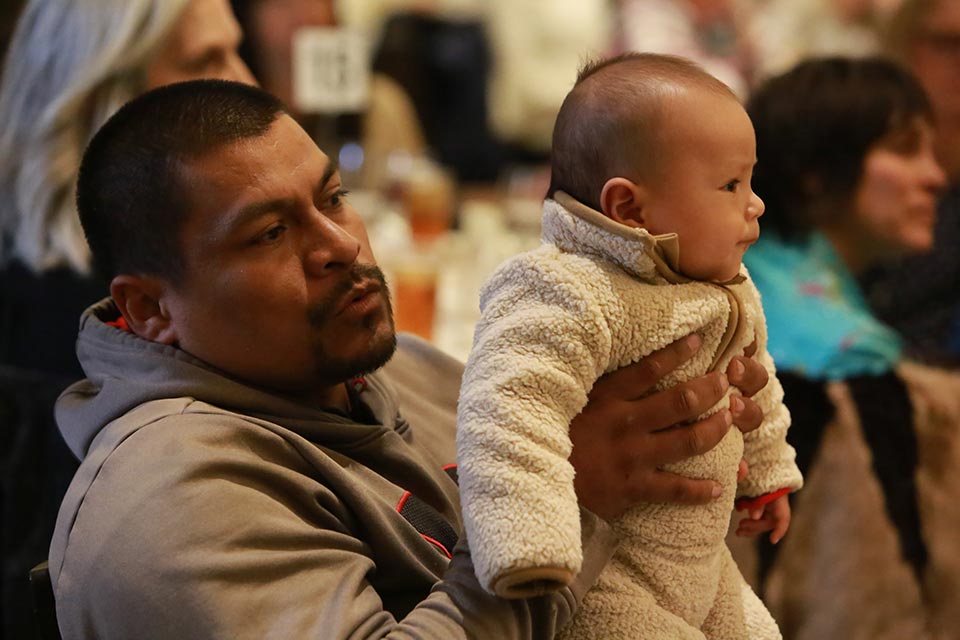 Father with baby at the KidZone's Think Big fundraiser