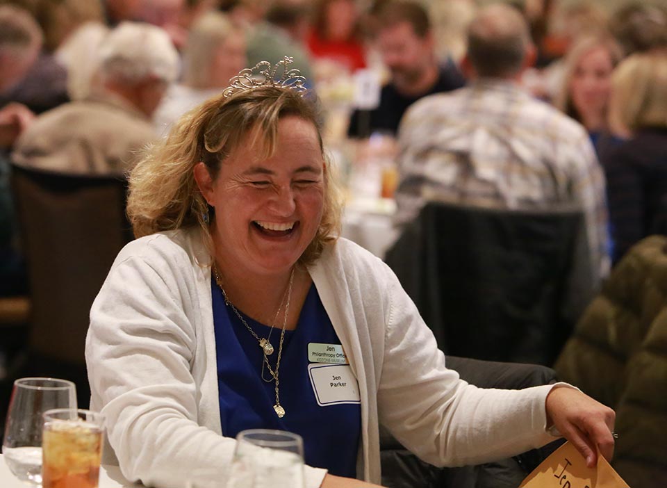 Woman laughing at the KidZone's Think Big fundraiser