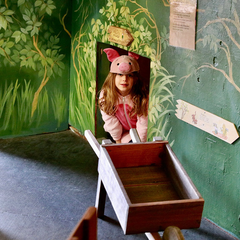 Girl pretending in play shop