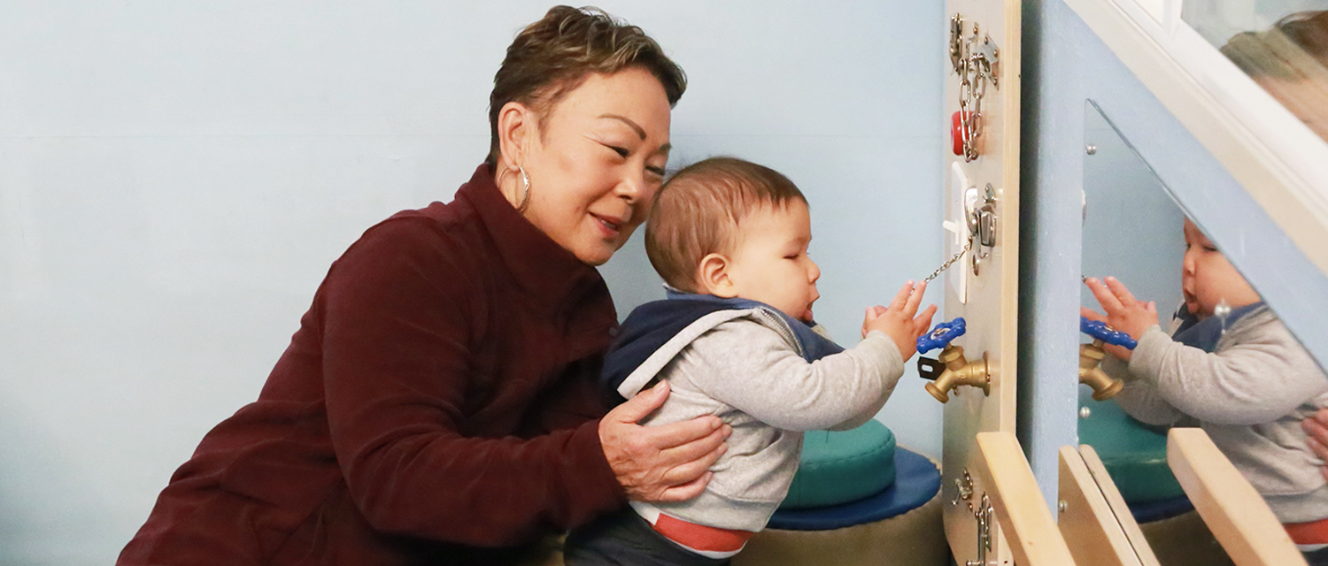 Mother and son playing in the infant area