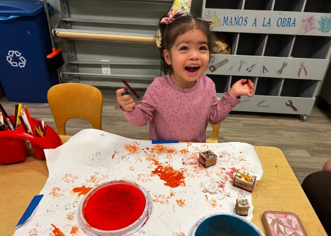 girl painting in the art room